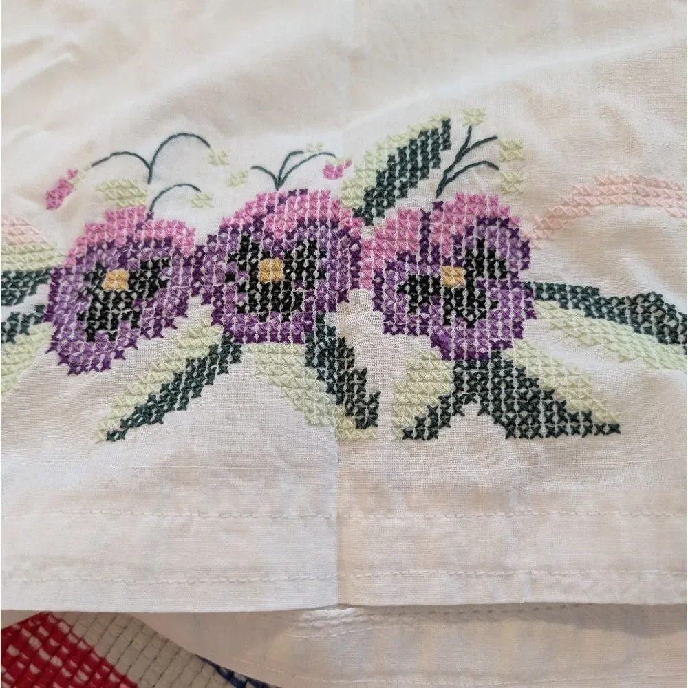 Vintage white pillowcase with embroidered purple‎ flowers